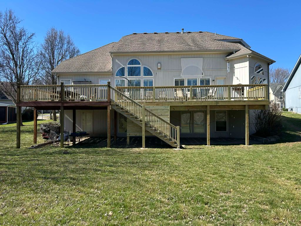 Large elevated deck side view showing structural craftsmanship - Staunch Properties