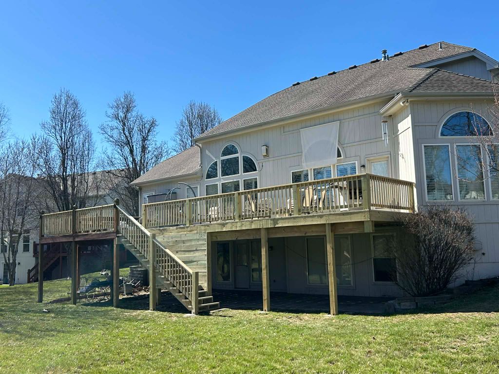 Large elevated deck with wraparound stairs built in Kansas City by Staunch Properties