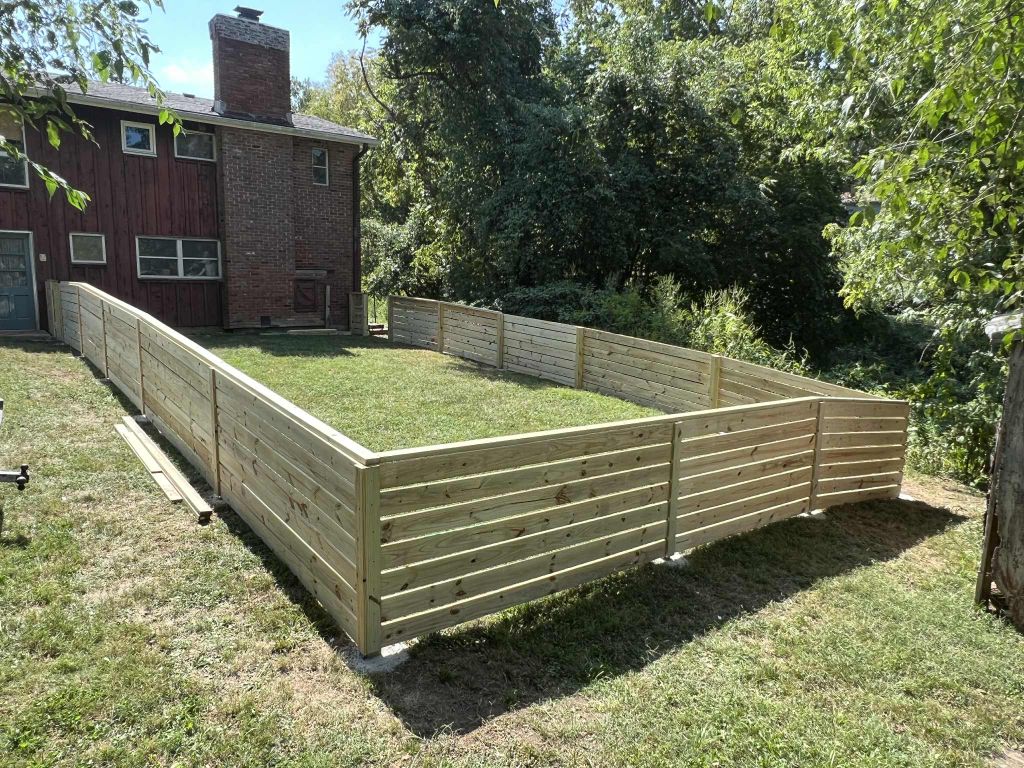 Modern horizontal slat privacy fence installed in Kansas City backyard
