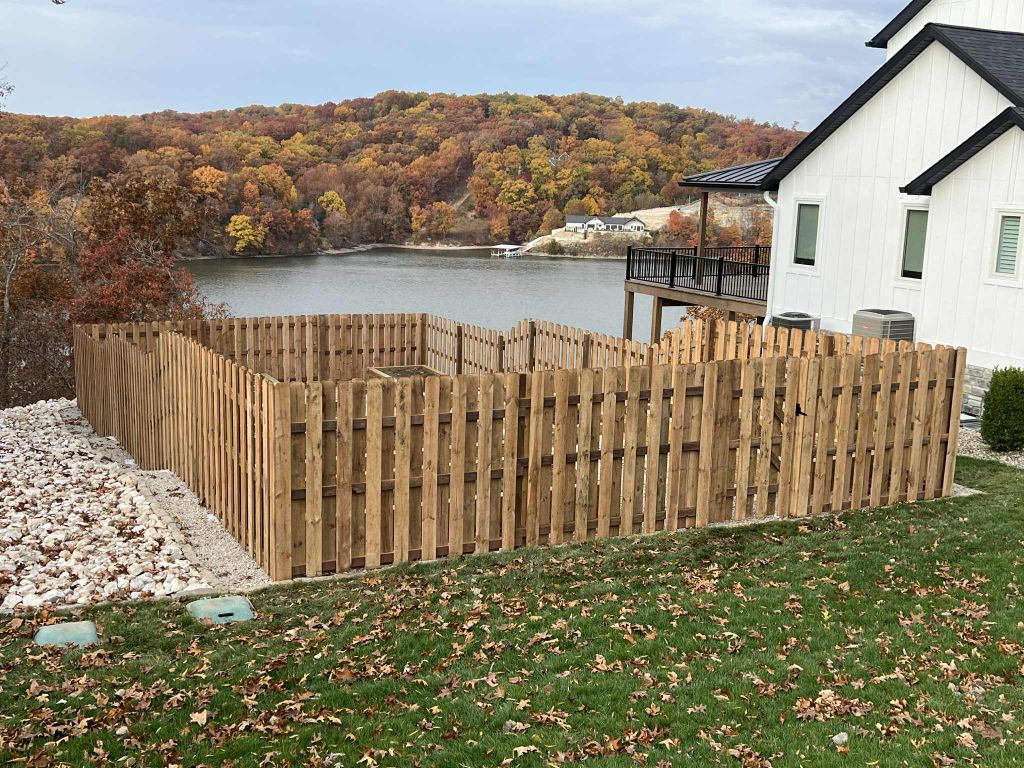 Lakeside cedar fence with professional landscaping installation